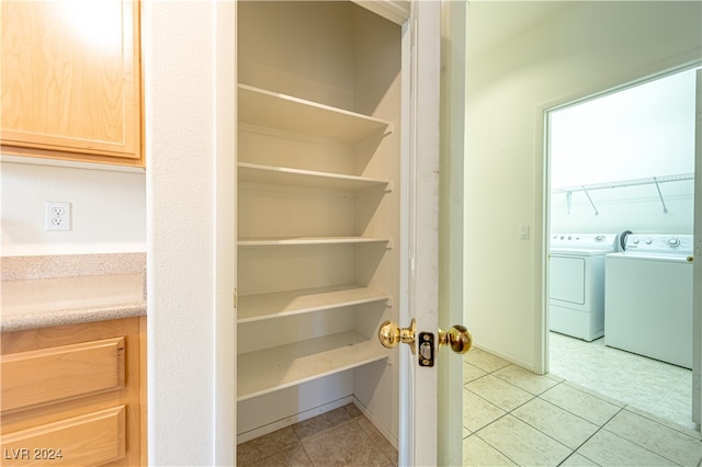 pantry featuring washing machine and dryer