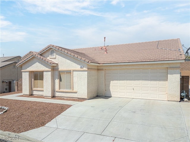 ranch-style home with a garage