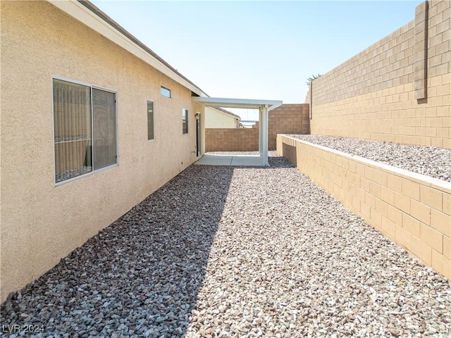 view of yard with a patio and a fenced backyard