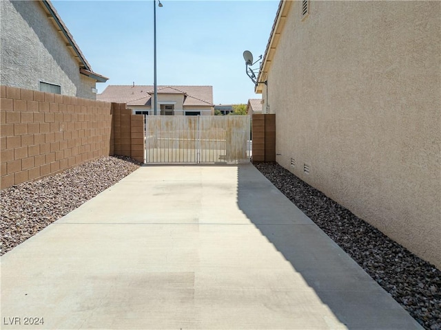 view of patio featuring a gate and fence