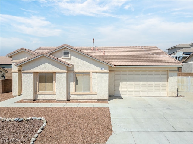 ranch-style home featuring a garage