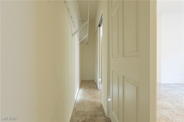 hallway with light tile patterned floors