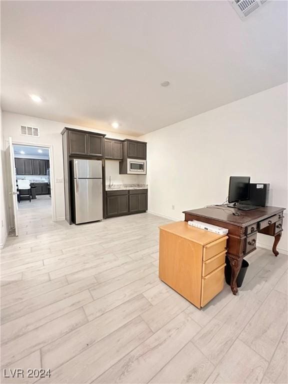 office with light hardwood / wood-style floors