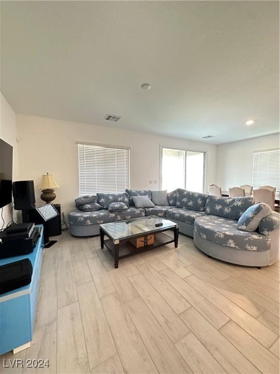 living room with light hardwood / wood-style floors