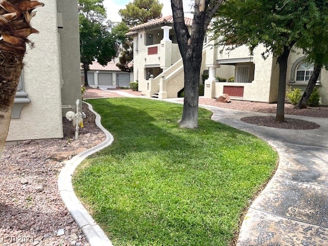 view of yard featuring a garage