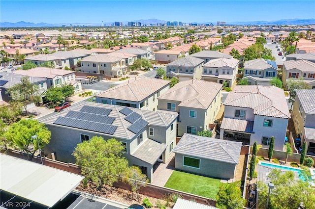 birds eye view of property featuring a mountain view