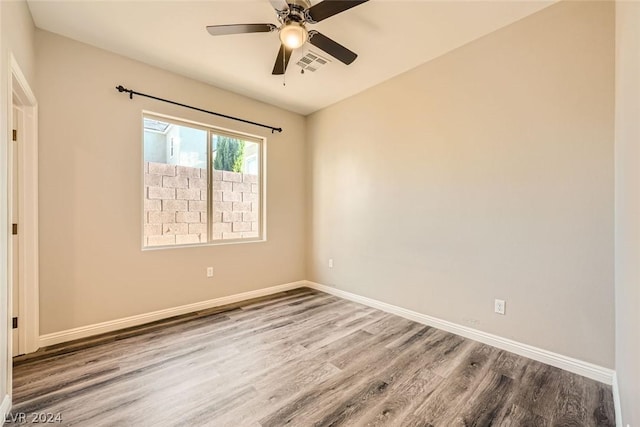 unfurnished room featuring hardwood / wood-style flooring and ceiling fan