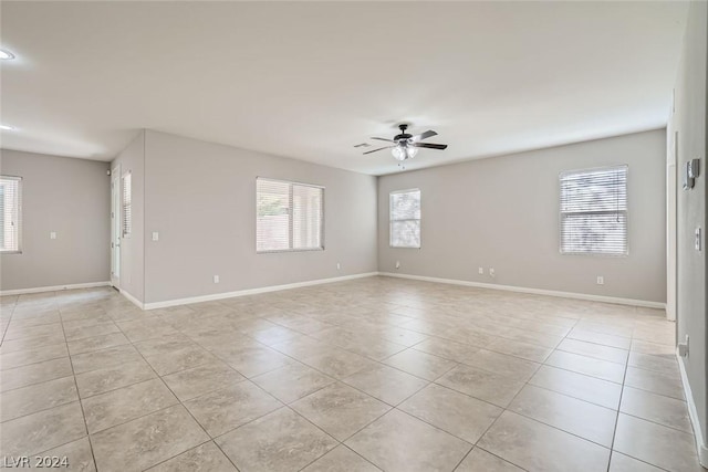 tiled empty room with ceiling fan