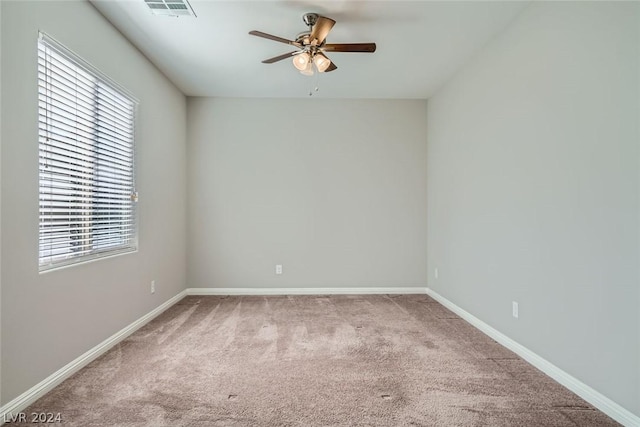 carpeted empty room with ceiling fan