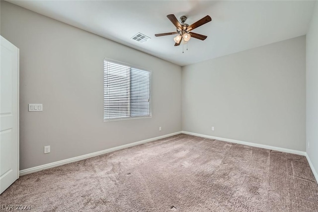 unfurnished room with ceiling fan and carpet flooring