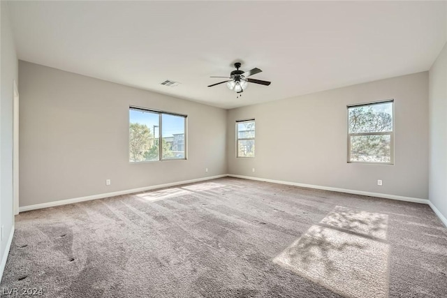 empty room with light carpet and ceiling fan