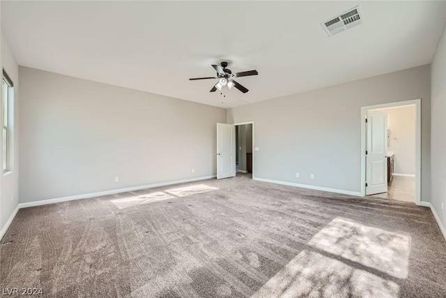 unfurnished bedroom with ceiling fan and light carpet