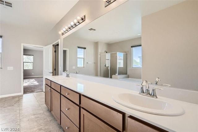 bathroom with vanity, independent shower and bath, and tile patterned flooring