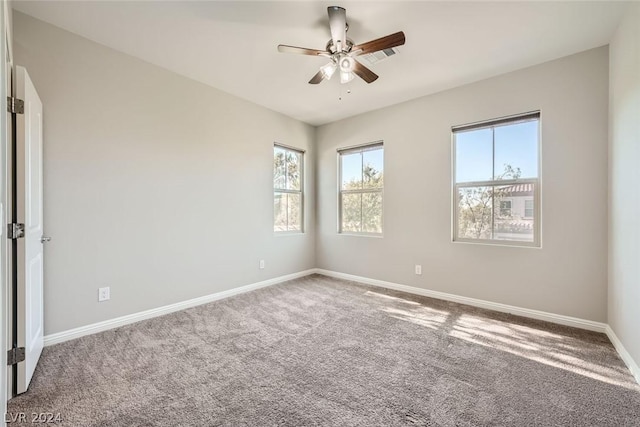 carpeted empty room featuring ceiling fan