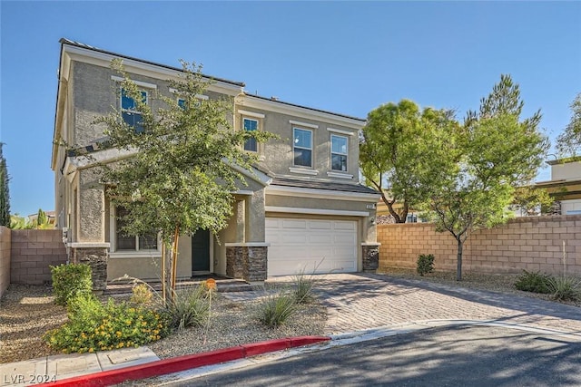 view of front of property with a garage