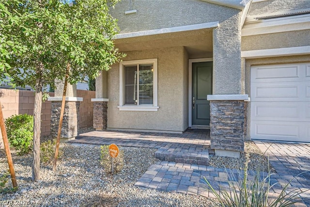 property entrance with a garage