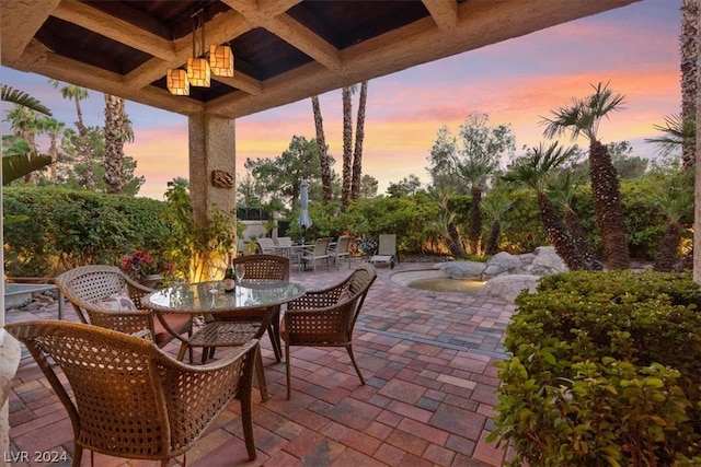 view of patio terrace at dusk