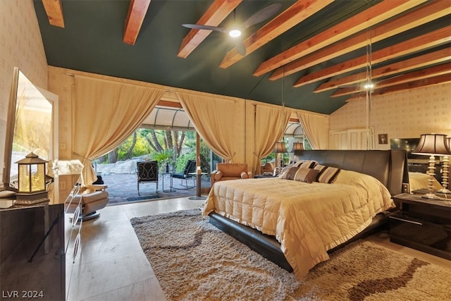 bedroom featuring beam ceiling and access to exterior