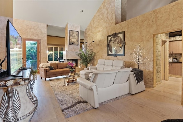 living room featuring high vaulted ceiling and light tile patterned floors