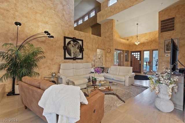 living room featuring a high ceiling