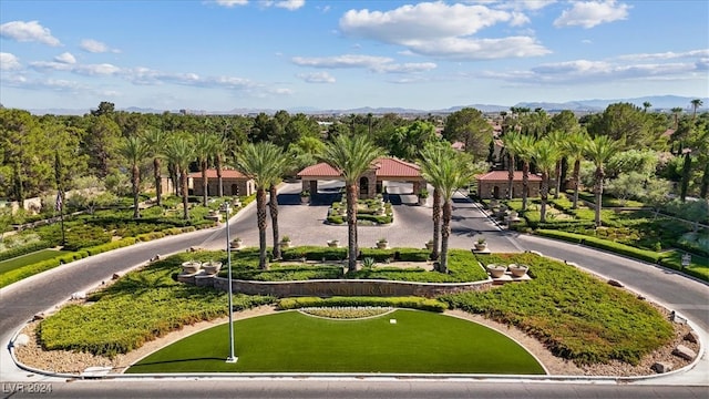 birds eye view of property with a mountain view