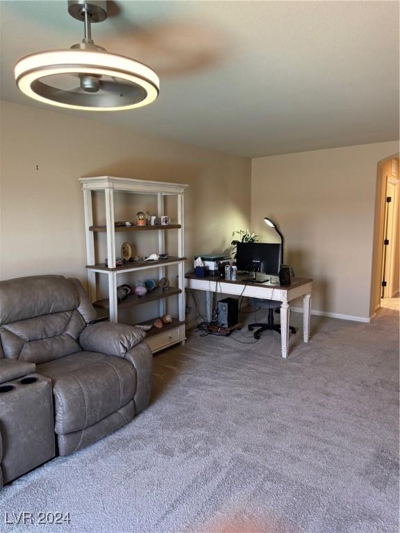 living area with carpet and baseboards