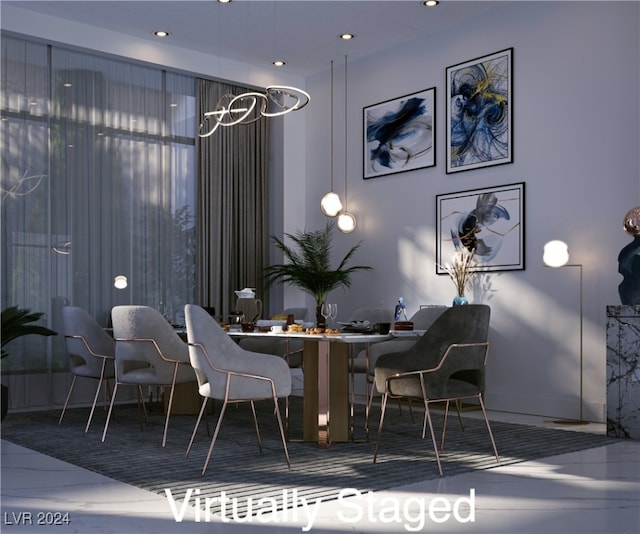 dining space featuring marble finish floor and recessed lighting