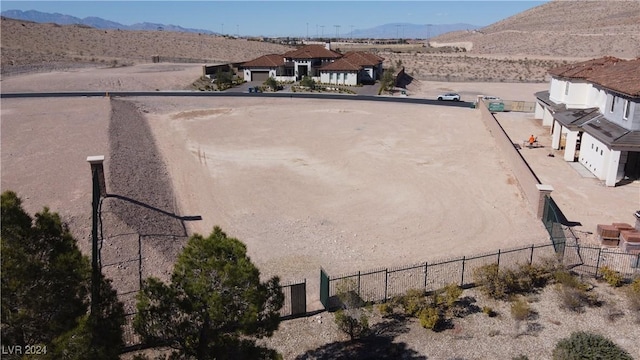 drone / aerial view with a mountain view and view of desert