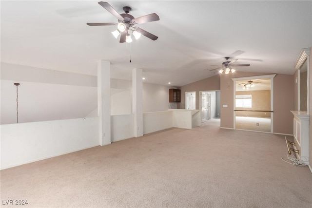 interior space featuring vaulted ceiling and light colored carpet