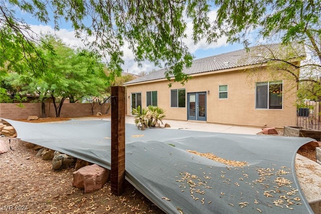 back of property with a patio area