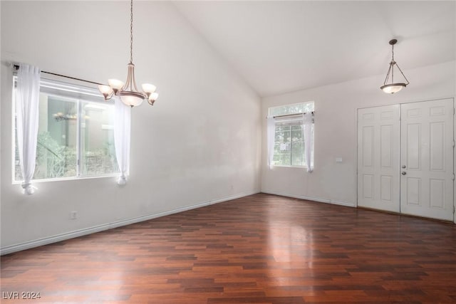 interior space featuring dark hardwood / wood-style floors, a notable chandelier, and high vaulted ceiling