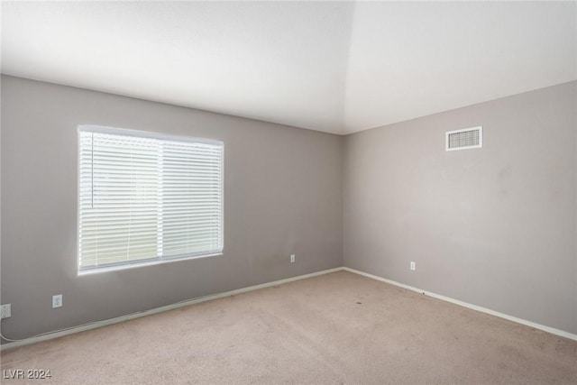 empty room featuring light carpet