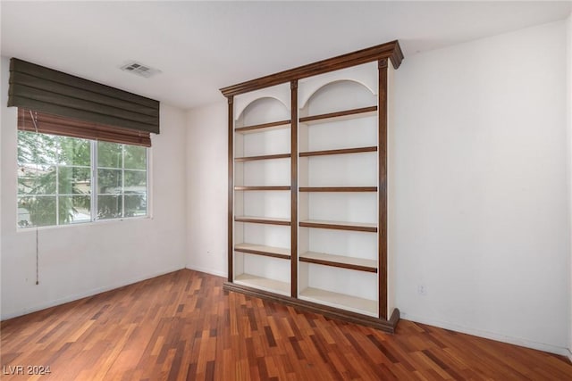 spare room with dark hardwood / wood-style floors