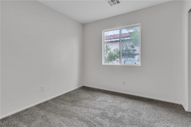 empty room with carpet flooring