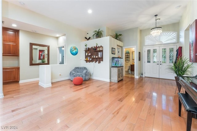 foyer featuring a notable chandelier and light hardwood / wood-style floors