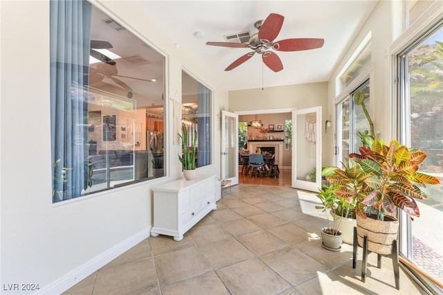 sunroom / solarium with ceiling fan