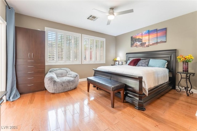 bedroom with ceiling fan and light wood-type flooring