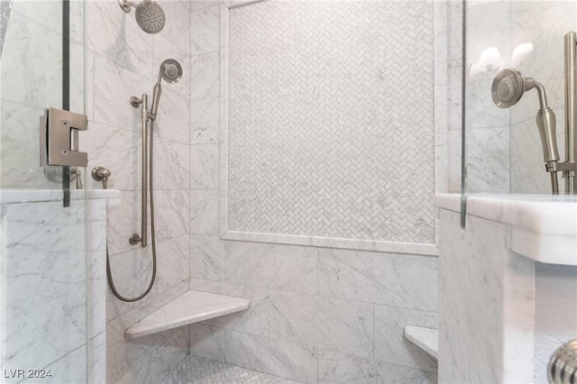 bathroom with a tile shower