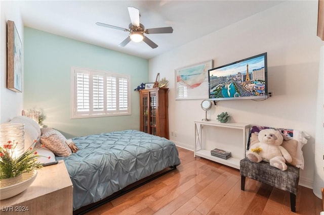 bedroom with hardwood / wood-style flooring and ceiling fan