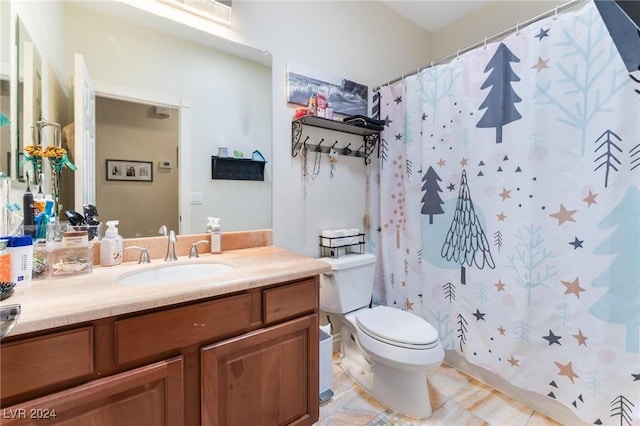 bathroom with vanity, tile patterned floors, toilet, and a shower with shower curtain