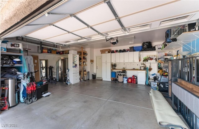 garage featuring a garage door opener