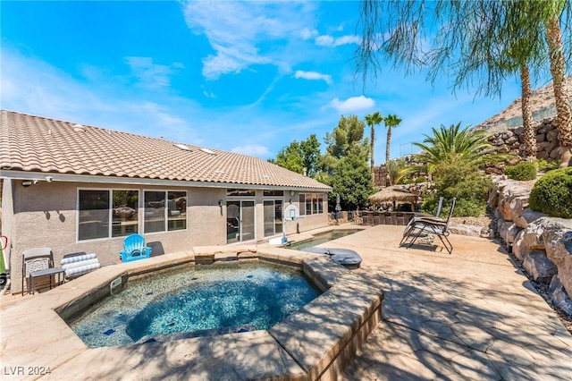 view of swimming pool featuring a patio