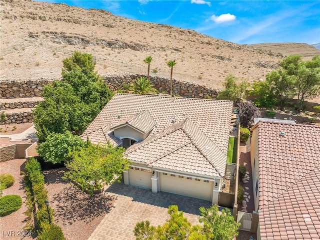 birds eye view of property with a mountain view