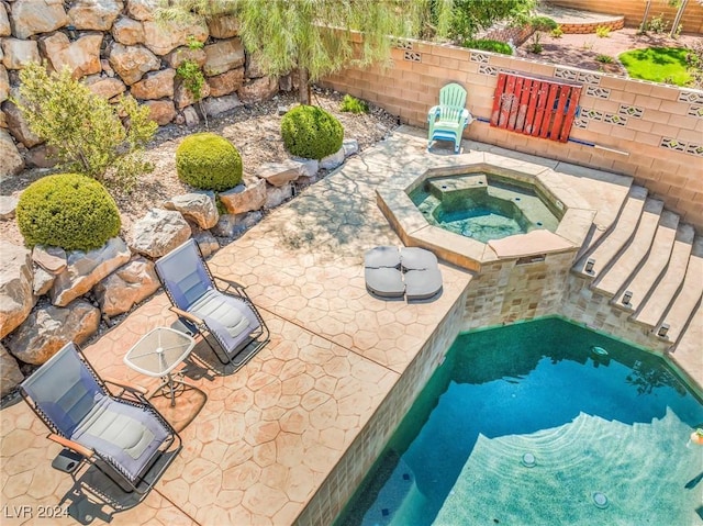 view of pool featuring an in ground hot tub and a patio area