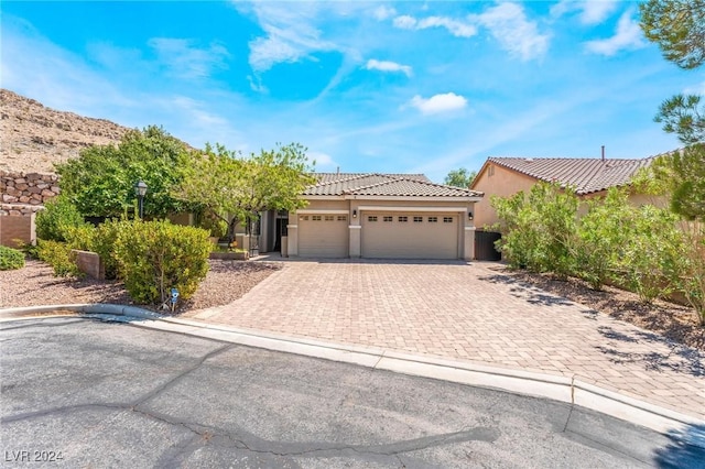 view of front of property with a garage