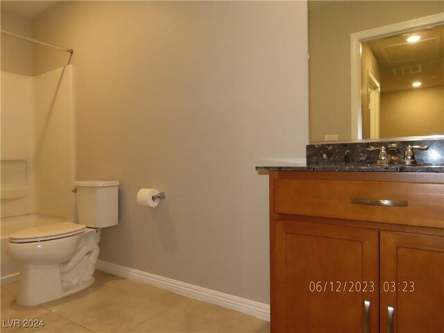 bathroom featuring vanity, toilet, and tile patterned floors