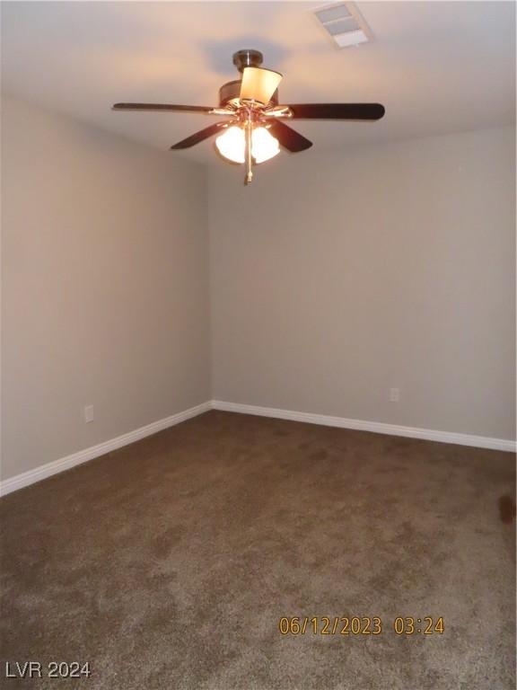 empty room with carpet and ceiling fan