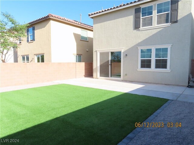 back of house with a patio area