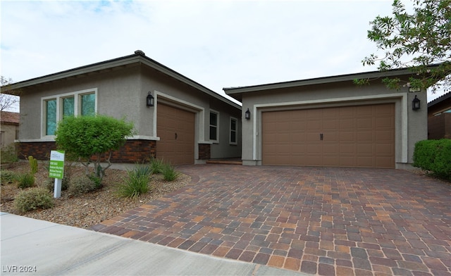 ranch-style house featuring a garage