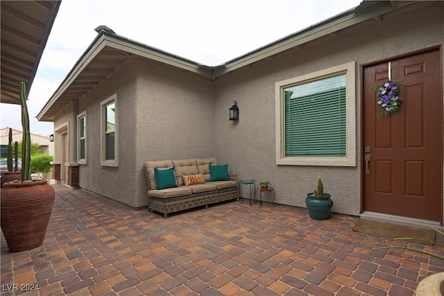 entrance to property featuring a patio area